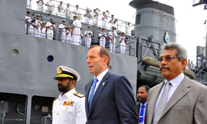Tony Abbott visits the Sri Lanka Navy vessel in Sri Lanka. Australia will expand cooperation between their navies to crack down on people smuggling. Photograph: Xinhua/Landov/Barcroft Media